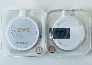 Front and back views of the EWS Analyzer device connected to a laptop, capturing and analyzing human energy waves.